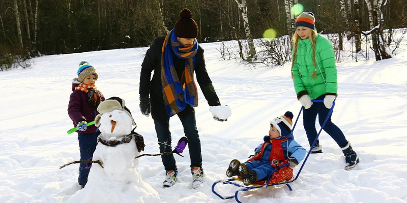 Winter gaming activities money snowman family min